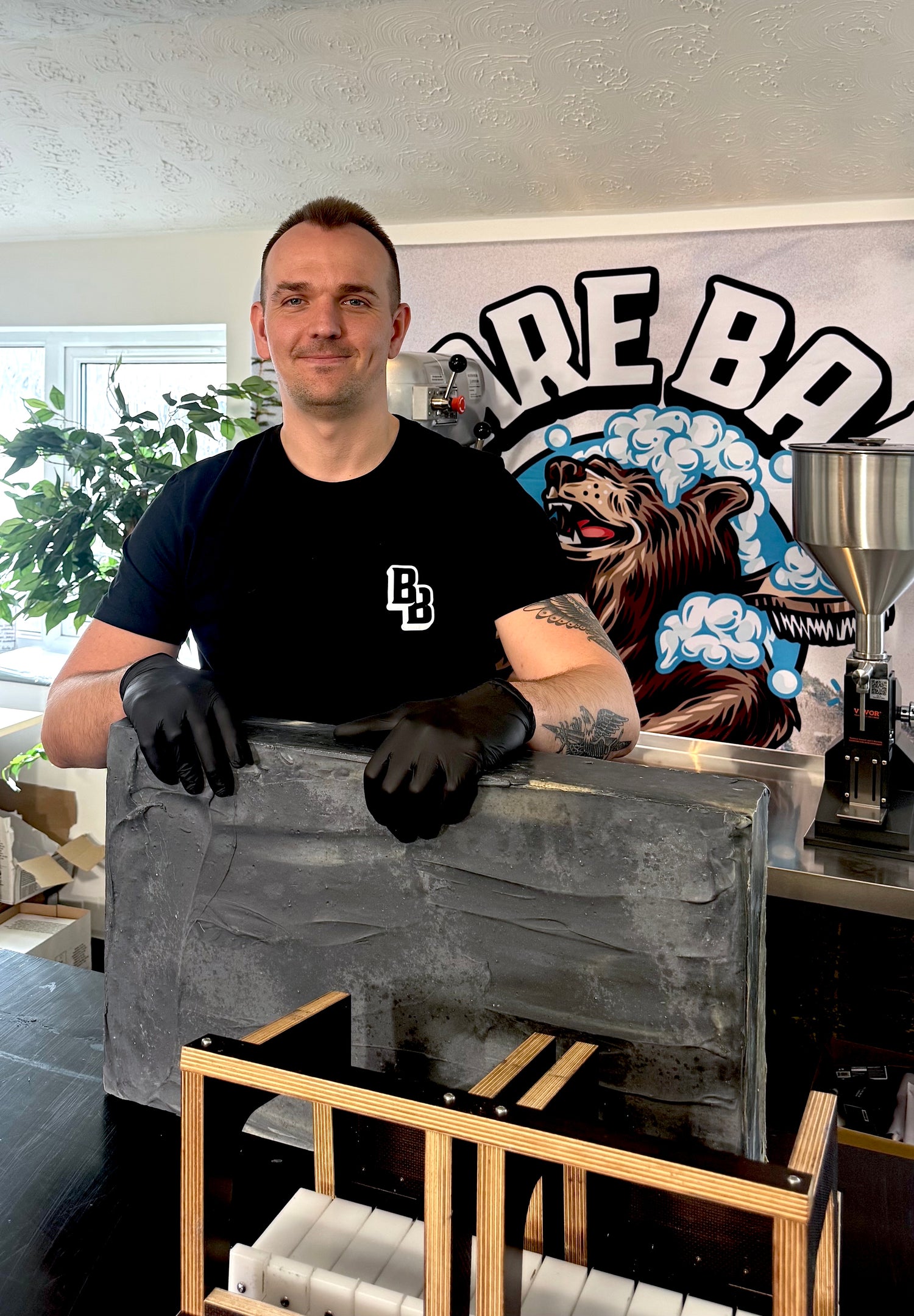Handmade natural soap being cut by Bare Bar founder in the UK